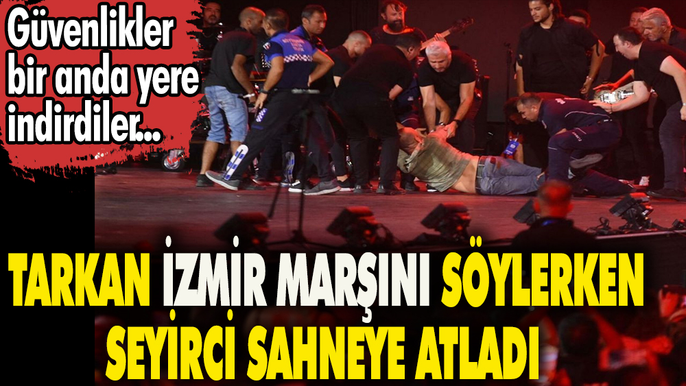 Tarkan İzmir marşını söylerken sahneye seyirci atladı. Güvenlikler bir anda yere indirdiler 1
