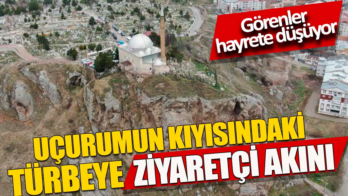 Uçurumun kıyısındaki türbeye ziyaretçi akını. Görenler hayrete düşüyor