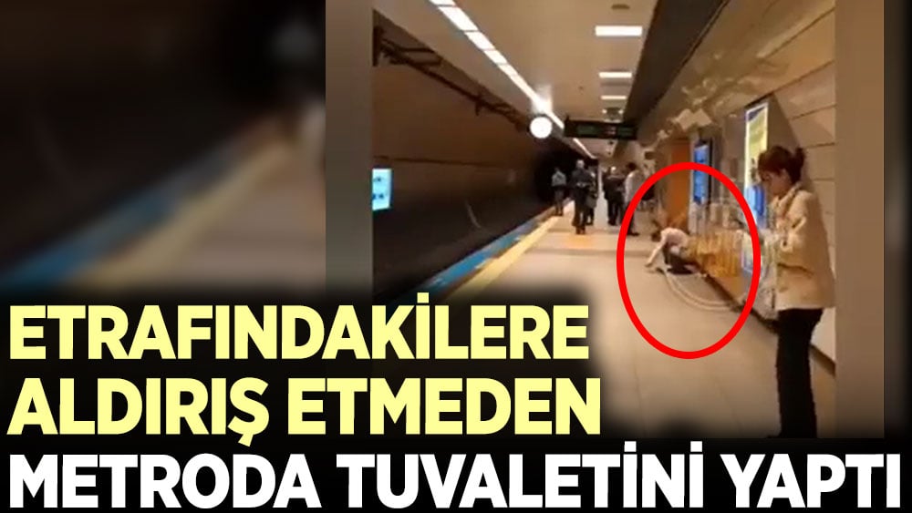 Etrafındakilere aldırış etmeden metroda tuvaletini yaptı