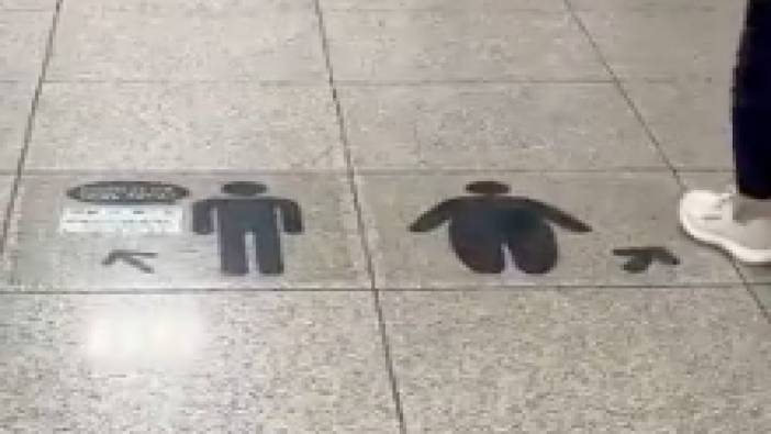 Kore'de şişmanları merdivene yönlendiren işaret
