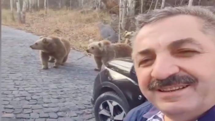 Erzurum'da ayılar tarafından yolu kesilen adamın keyifli anları