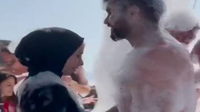 Eşiyle köpük partisi yapan türbanlı kadının videosu yeniden gündem oldu