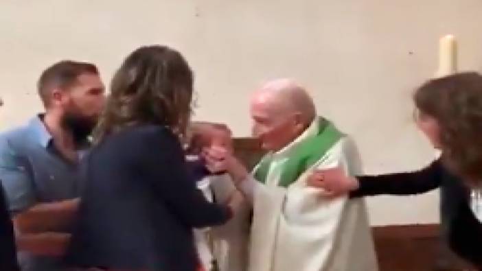 Fransa'da bir rahip, vaftiz töreninde ağlayan bebeğe tokat attı