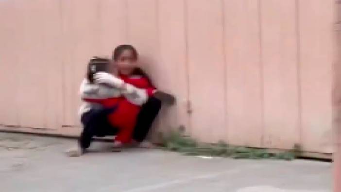 İsrail'in hava saldırısından korkan kardeşini sarılarak korumaya çalışan küçük kız yürekleri sızlattı
