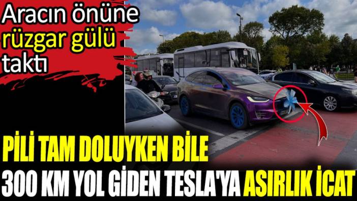 Pili tam doluyken bile 300 km yol giden Tesla'ya asırlık icat. Aracın önüne rüzgar gülü taktı