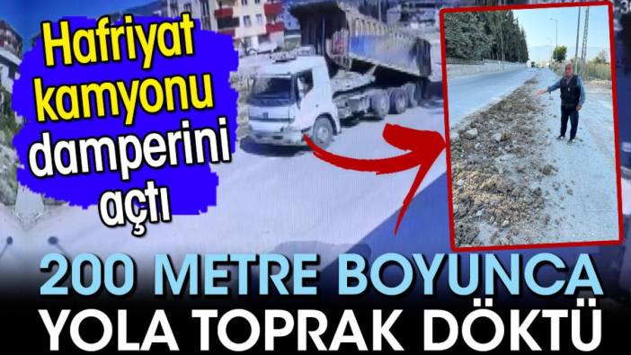 Hatay'da damperini açan kamyon, 200 metre boyunca yola toprak döktü