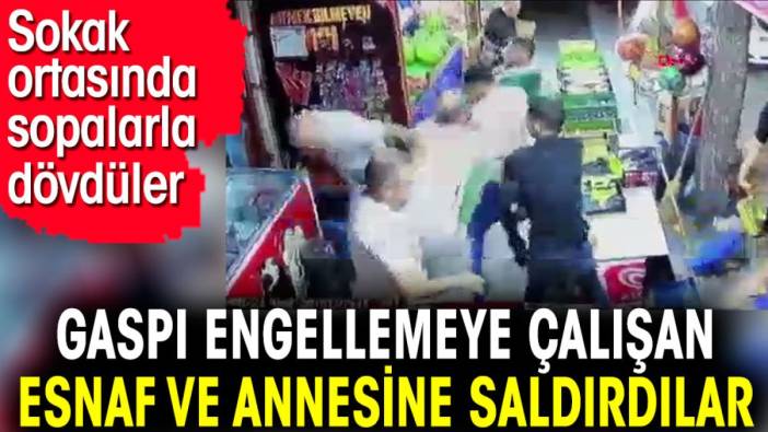 Gaspı engellemeye çalışan esnaf ve annesine saldırdılar. Sokak ortasında sopalarla dövdüler