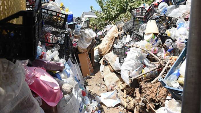 Gecekondudan 14 kamyon çöp çıktı