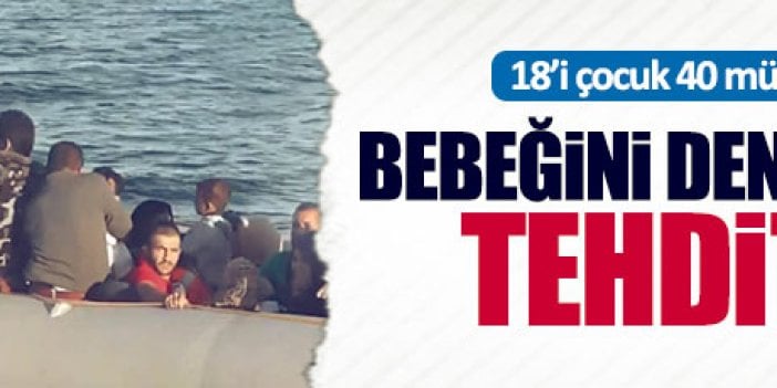 Bebeğini denize atmakla tehdit etti