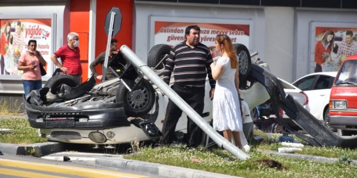 Takla atan otomobilden yara almadan çıktılar
