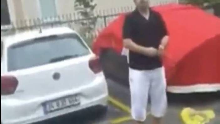 O bayrak için şehit olanlardan utanmadın mı be adam, arabasını doludan korumak için Türk bayrağı örttü