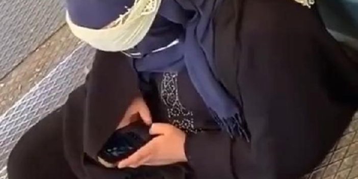 Dilencilik yapan bir kadın, son model iphone marka telefonuyla görüntülendi