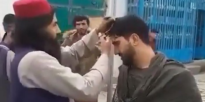 Taliban, gencin şeklini beğenmediği saçını döve döve kesti