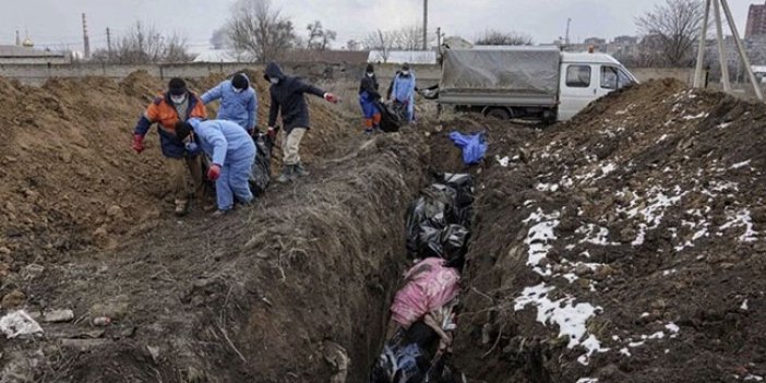 Savaşın en acı tablosu... Ukrayna'da hayatını kaybeden siviller için toplu mezarlar kazılıyor