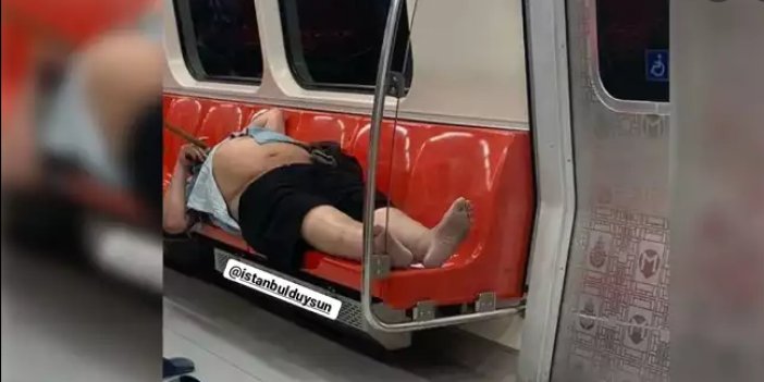 İstanbul metrosunda rezil görüntü. Yarı çıplak koltuklara yattı