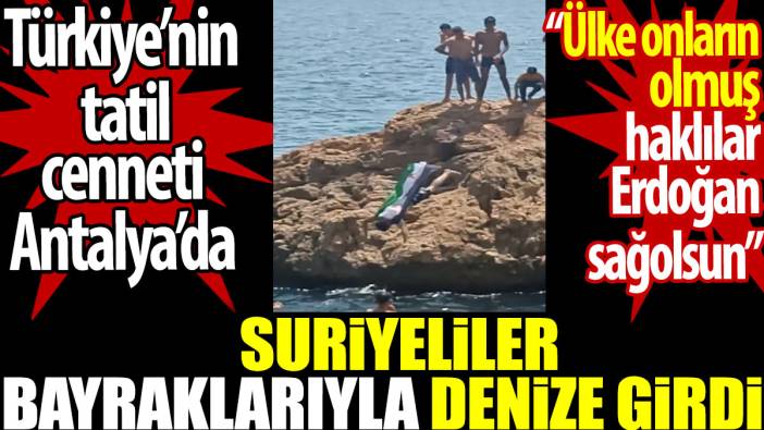 Antalya’da Suriyeliler bayraklarıyla ile denize girdi. Ülke onların olmuş