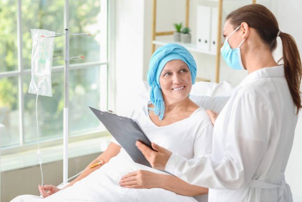 stock-photo-doctor-telling-good-news-mature-woman-chemotherapy-clinic.jpeg