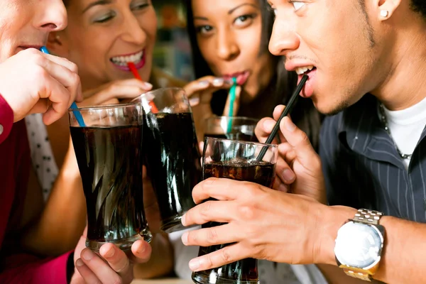 depositphotos-79386160-stock-photo-friends-drinking-soda-in-a.jpg