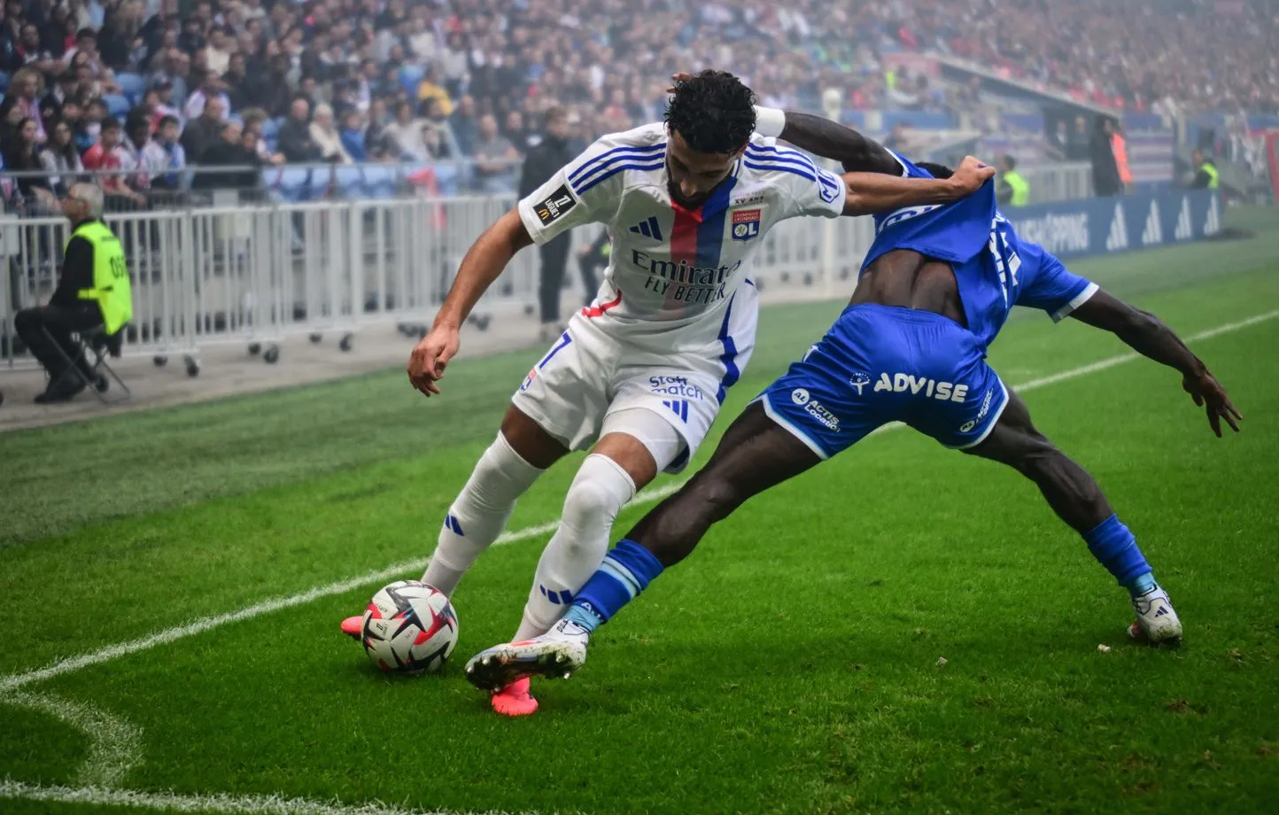 1444x920-lyon-s-algerian-forward-17-said-benrahma-l-fights-for-the-ball-with-auxerre-s-ghanaian-defender-14-gideon-mensah-during-the-french-l1-football-match-between-lyon-ol-and-auxerre-aja-at-the-parc-olympique-lyonnais-stadium-in-decines.webp