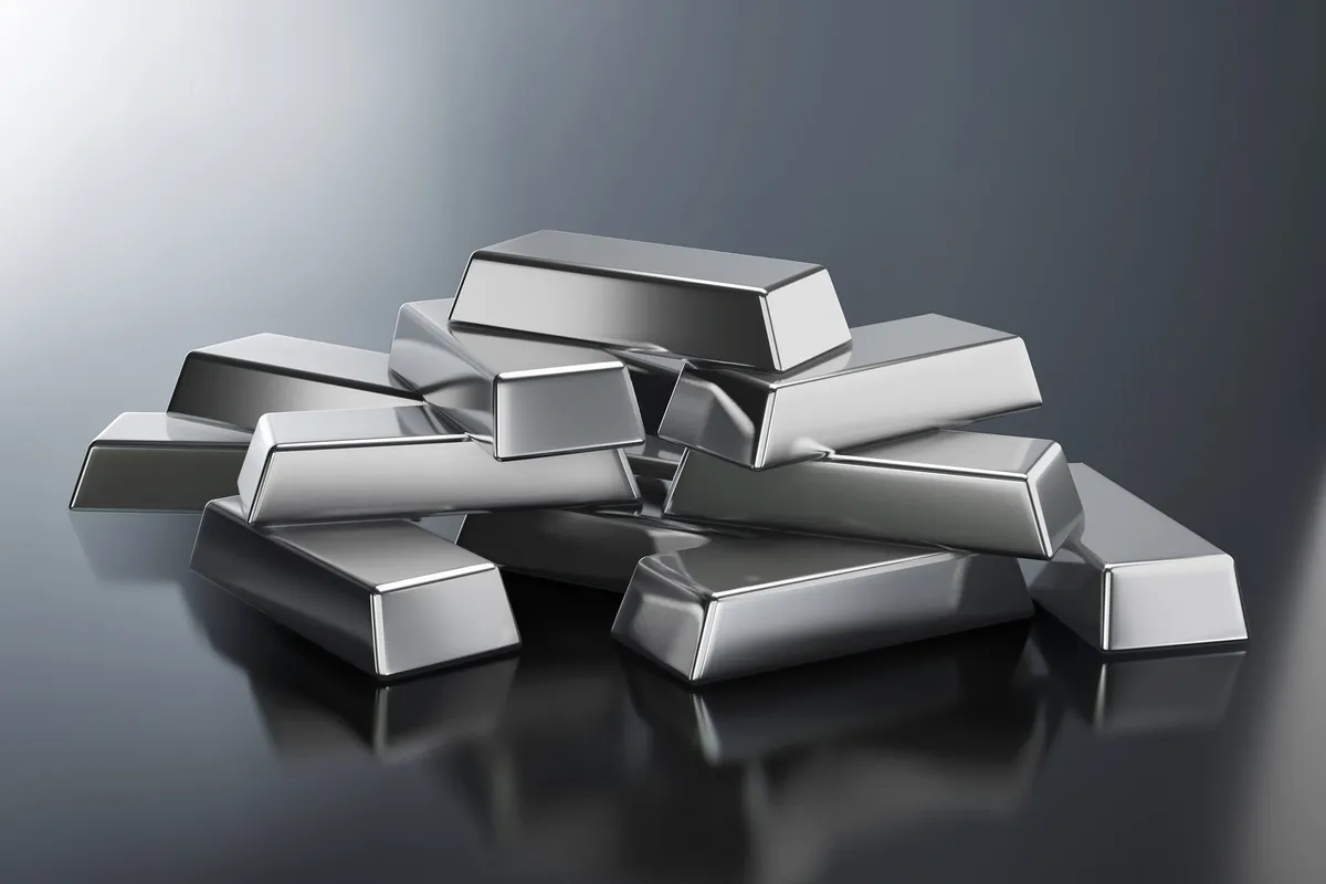 silver-bars-on-shiny-metallic-surface.webp
